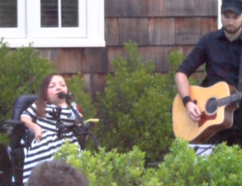 Arlanna Snow, EBHS Class of 1997, performing an original song at the 2018 Bench Dedication